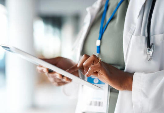 Healthcare worker using tablet