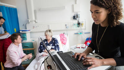 Doctors And Patient In Hospital
