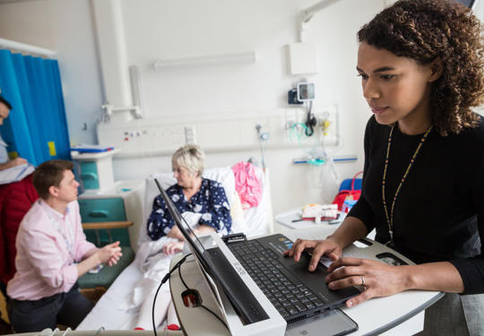 Doctors And Patient In Hospital