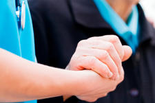Doctor And Patient Holding Hands
