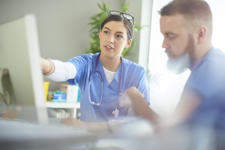 Doctors using computer