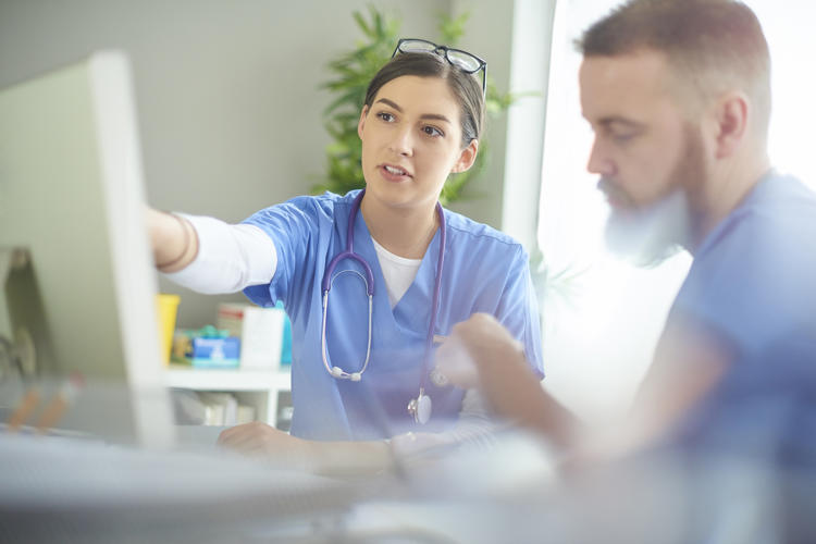 Doctors using computer