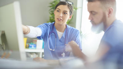 Doctors using computer
