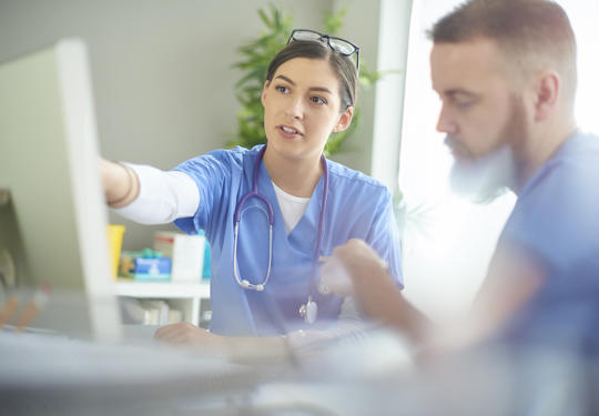 Doctors using computer
