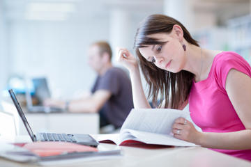 Student Studying In Library