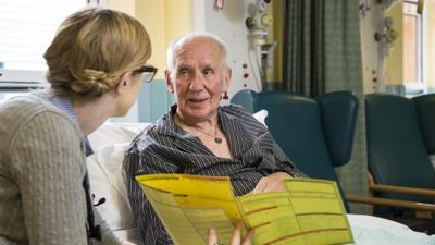 Doctor and patient in bed