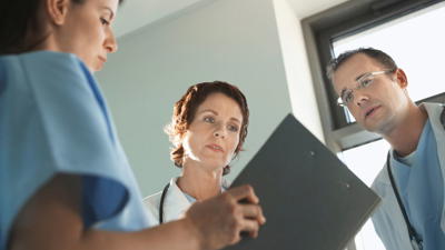 Doctors Looking At A File