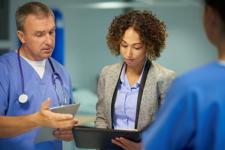 Doctors looking at notes