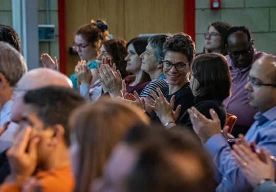 Event attendees clapping