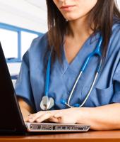 Doctor using laptop